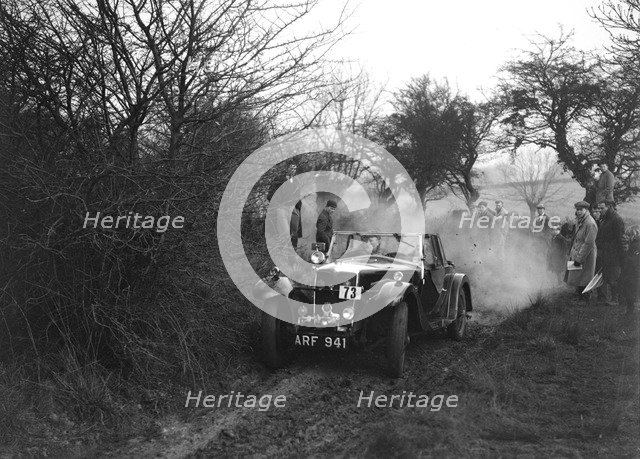 Riley of C Beddow at the Sunbac Colmore Trial, near Winchcombe, Gloucestershire, 1934. Artist: Bill Brunell.