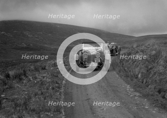 Aston Martin of Mrs JW Rutherford competing in the RSAC Scottish Rally, 1934. Artist: Bill Brunell.