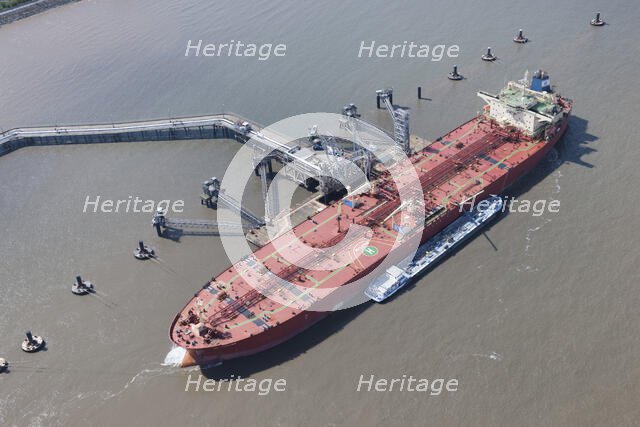 A ship moored up at floating stage on the River Mersey at Tranmere Oil Terminal, Wirral, 2015. Creator: Historic England.