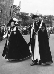 The Queen and Prince Philip walking in procession to the Queen's Free Chapel of St George, 1970. Artist: Unknown