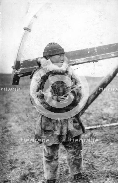 Chukchi boy in national clothes, kukhlyanka, fur pants, 1910-1929. Creator: Ivan Emelianovich Larin.