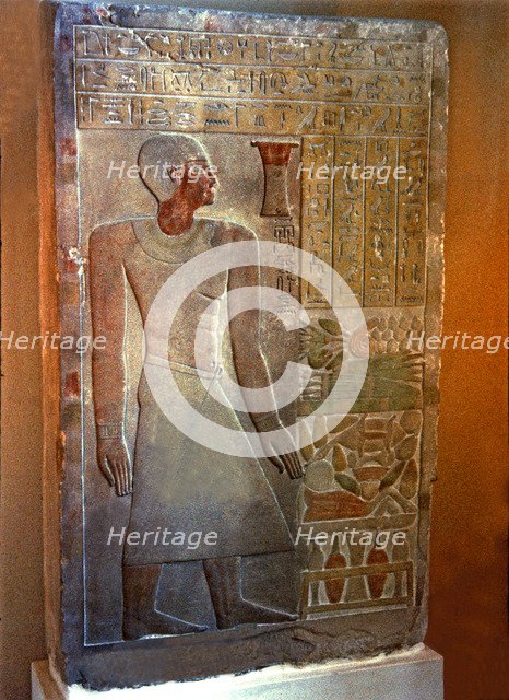 Stela of the Senouret, chief of the royal treasury, with his image and hieroglyphic writing, made…