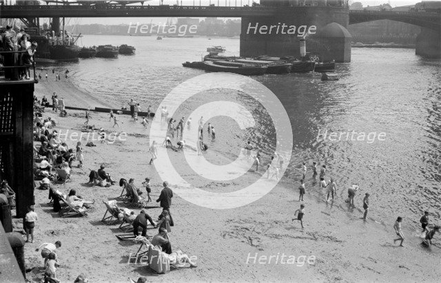 People relaxing on Tower Beach, London, c1945-c1955. Artist: SW Rawlings