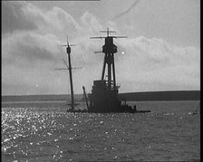 The Hulls of German Warships Scuttled in Scapa Flow Rising from the Waves, 1929. Creator: British Pathe Ltd.