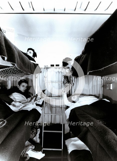 Interior of a traveler car wagon with bunks, 1950.