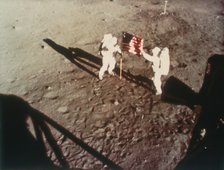 Armstrong and Aldrin unfurl the US flag on the moon, 1969. Artist: Unknown