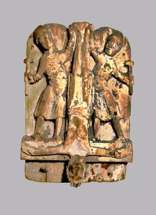 Crucifixion of St. Peter, 12th century carving.