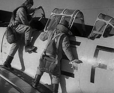 British Pilots Entering a Fighter Plane, 1941. Creator: British Pathe Ltd.