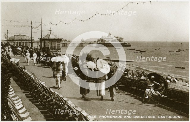 Pier, promenade and bandstand, Eastbourne, Sussex, c1920s(?). Artist: Unknown