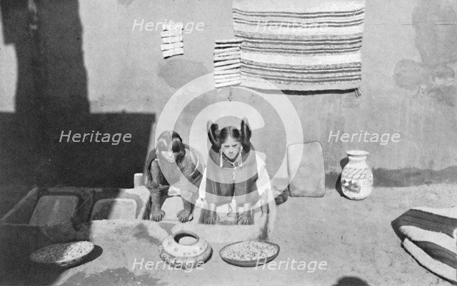 Hopi Indian women grinding corn meal, Walpi, Arizona, 1912. Artist: Robert Wilson Shufeldt.