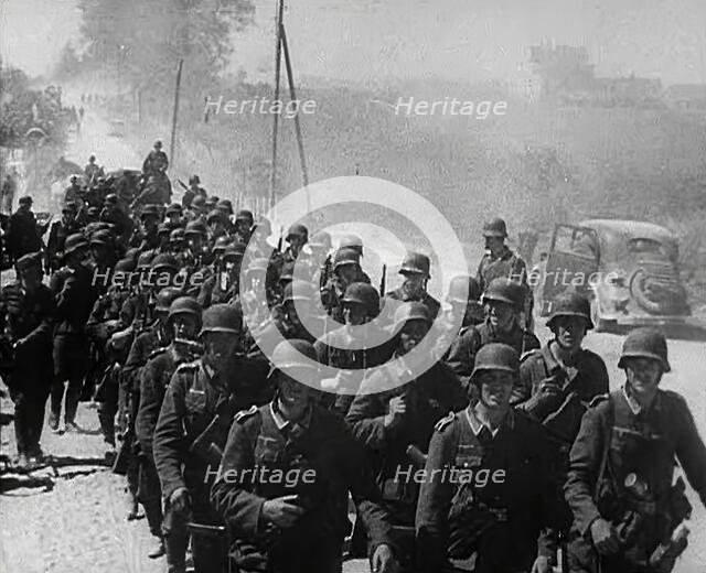 German Soldiers Marching Down a Road, 1941. Creator: British Pathe Ltd.