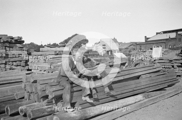 Two men in a woodyard, Landskrona, Sweden, 1935. Artist: Unknown
