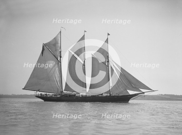 The three-mast auxiliary schooner 'Invincible', 1911. Creator: Kirk & Sons of Cowes.