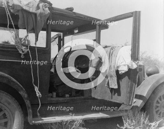 The only home of a depression-routed family of nine from Iowa, 1936. Creator: Dorothea Lange.