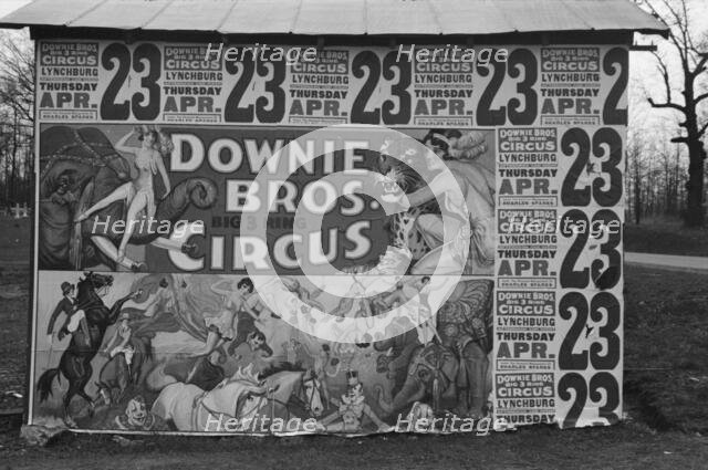 Posters covering a building near Lynchburg to advertise a Downie Bros. circus, 1936. Creator: Walker Evans.