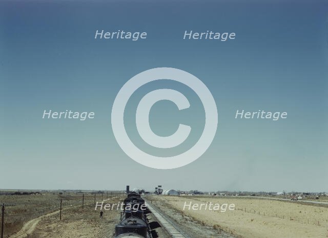 Westbound freight train stopping for water, Melrose, New Mexico, 1943. Creator: Jack Delano.