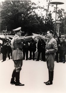 Nazi leaders Adolf Hitler and Rudolf Hess exchanging salutes, c1930s-c1940s. Artist: Unknown