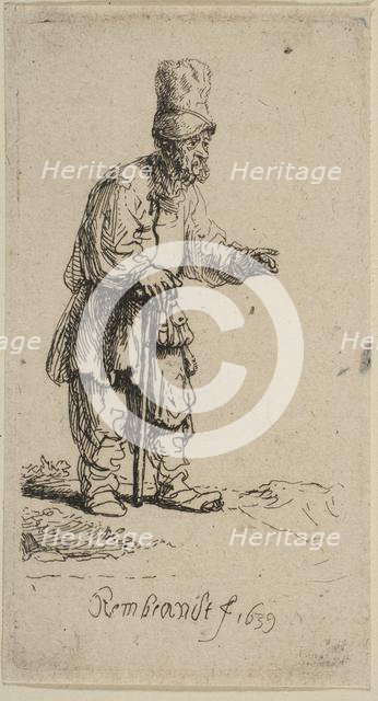 A Peasant in a High Cap, Standing Leaning on a Stick, 1639. Creator: Rembrandt Harmensz van Rijn.