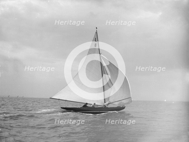 'Scotia IV' running downwind with spinnaker, 1913. Creator: Kirk & Sons of Cowes.