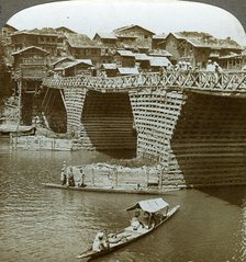 Quaint bridge and houses, City of Sun, Kashmir, India, c1900s(?).Artist: Underwood & Underwood