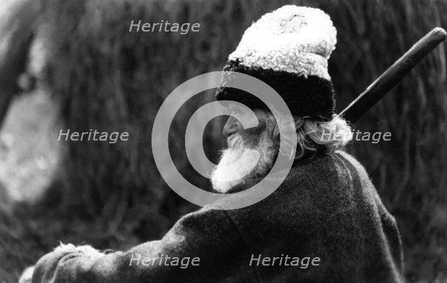 Old man wearing a woolly hat, Bistrita Valley, Moldavia, north-east Romania, c1920-c1945. Artist: Adolph Chevalier