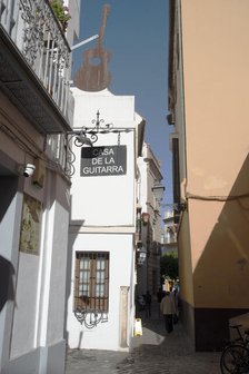 One of the narrow streets in the pedestrian area of the central city, Seville, Spain, 2023. Creator: Ethel Davies.