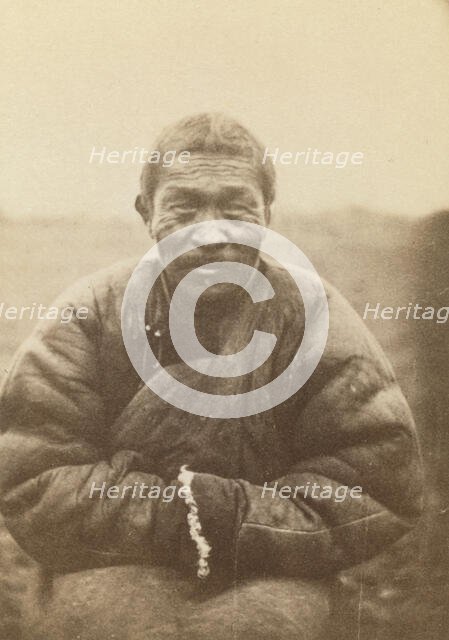 Half-length portrait of man, seated, facing front, between 1870 and 1886. Creator: Unknown.