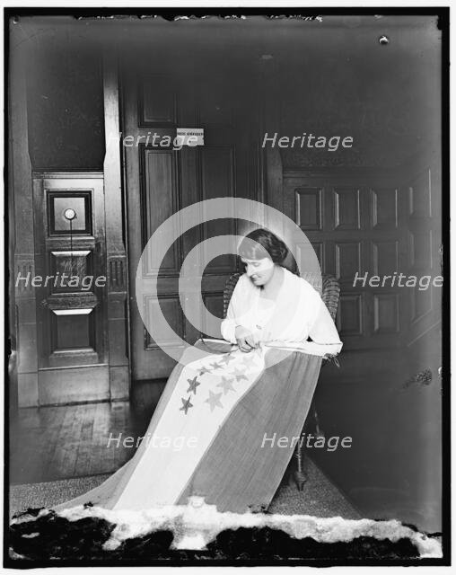 Sewing stars on suffrage flag, between 1910 and 1920. Creator: Harris & Ewing.