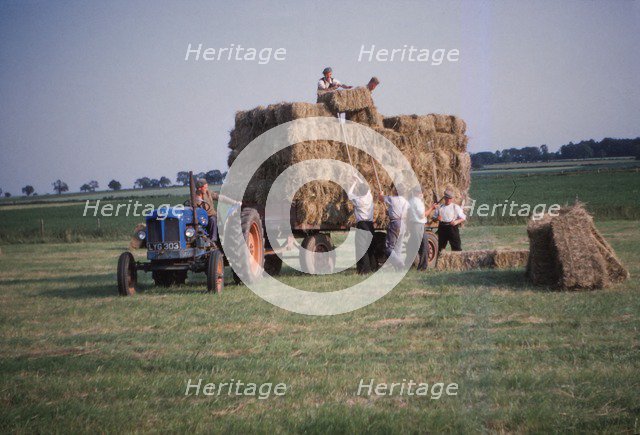 Loading bales of hay, England, c1960. Artist: CM Dixon.