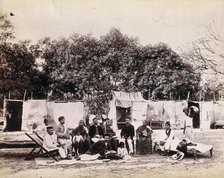 An affluent family forced to leave their home due to plague in their neighbourhood sitting...1896/7. Creator: Unknown.