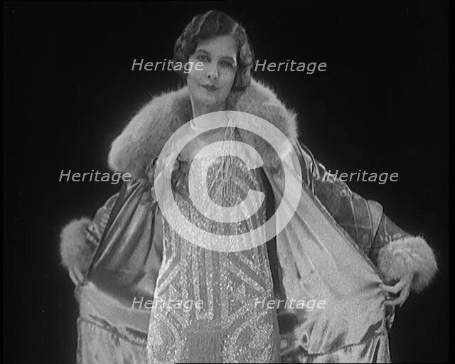 Female Civilian Modelling a Glamorous Fur Trimmed Coat, 1920. Creator: British Pathe Ltd.