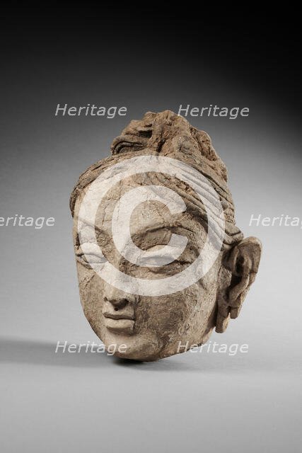 Head of a female. From Ajina Tepe, 7th-8th century. Creator: Central Asian Art.