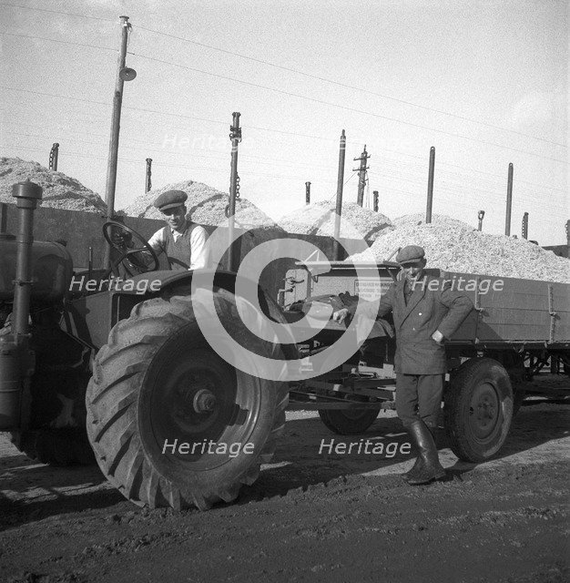 Tractors and loaded trailers at the sugar mill in Arlöv, Scania, Sweden, c1940s(?). Artist: Otto Ohm