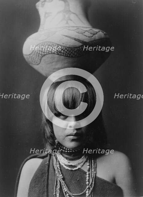 Girl and jar-San Ildefonso, c1927. Creator: Edward Sheriff Curtis.