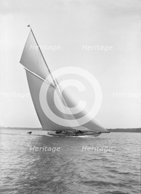 The 15 Metre sailing yacht 'Paula III' in fine form, 1913. Creator: Kirk & Sons of Cowes.