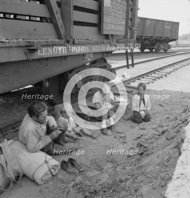 Family who traveled by freight train, Washington, Toppenish, Yakima Valley, 1939. Creator: Dorothea Lange.