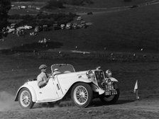 A Singer Nine Le Mans climbing a hill, 1935. Artist: Unknown