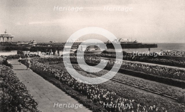 Floral gardens and the West Pier, Brighton, Sussex, 1938. Artist: Unknown