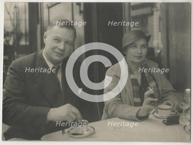 Natalia Goncharova and Mikhail Larionov at the Restaurant Petit Saint-Benoît, 1932. Creator: Anonymous.