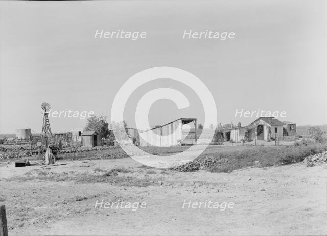 This family from Arkansas had one thousand dollars when they arrived in California, 1938. Creator: Dorothea Lange.