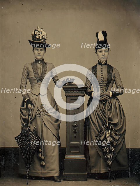 Studio Portrait of Two Women Holding Folded Parasols, ca. 1885. Creator: Unknown.