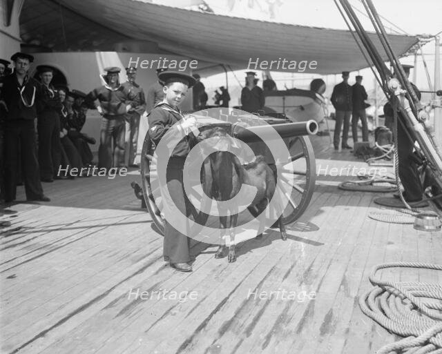 U.S.S. New York, Admiral Sampson's son and Pitch the mascot, between 1893 and 1901. Creator: William H. Jackson.