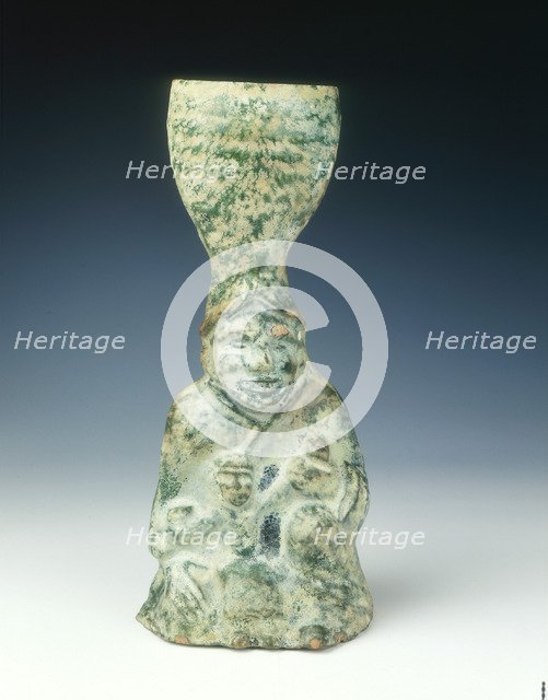Candlestick of a human figure with infant, Eastern Han dynasty, 25 AD-220 AD. Artist: Unknown