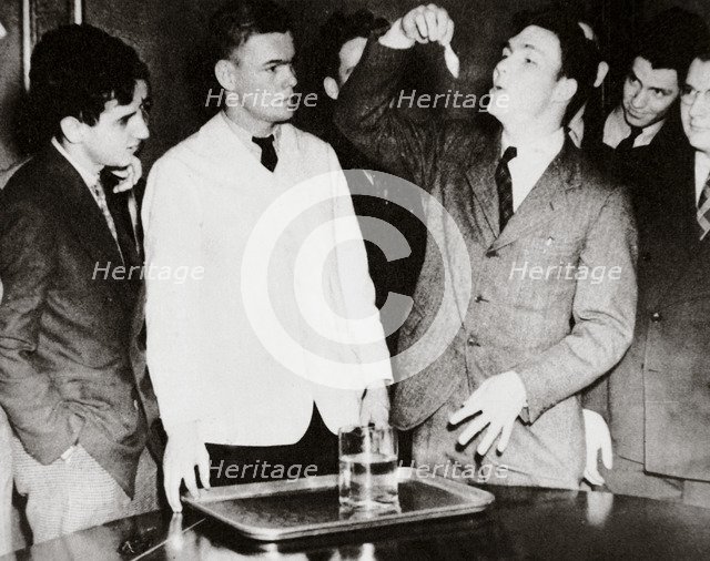 Lothrop Withington, Jr (right), a Harvard freshman, swallowing a goldfish, USA, 1935. Artist: Unknown