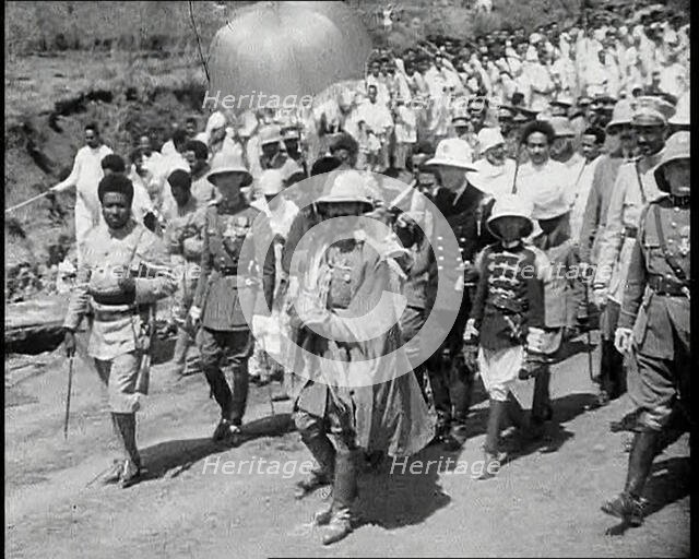 Haile Selassie I, Emperor of Ethiopia Walking with a Crowd, 1930s. Creator: British Pathe Ltd.