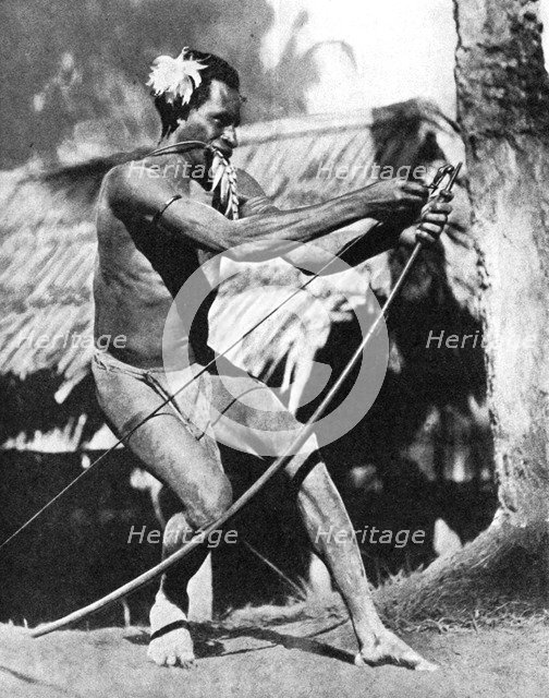 A huntsman stringing his bow, 1936.Artist: Wide World Photos