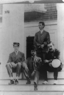 Four men, friends of Frances Benjamin Johnston, posed on porch, between 1900? and 1930. Creator: Frances Benjamin Johnston.
