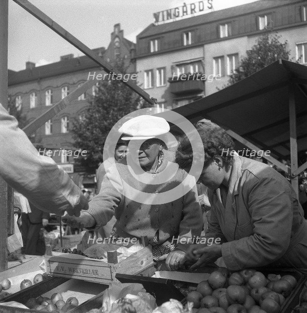 Fruit and vegetable stall in the market, Malmö, Sweden, 1947. Artist: Otto Ohm