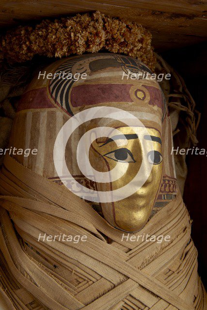 Ptolemaic coffin, mummy with gilt mask and floral garlands, Roman Period (Egypt), c30BC-AD641. Artist: Unknown.