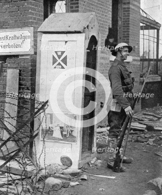 A British soldier on sentry duty after the fall of Peronne, France, First World War, 1917, (c1920). Artist: Unknown